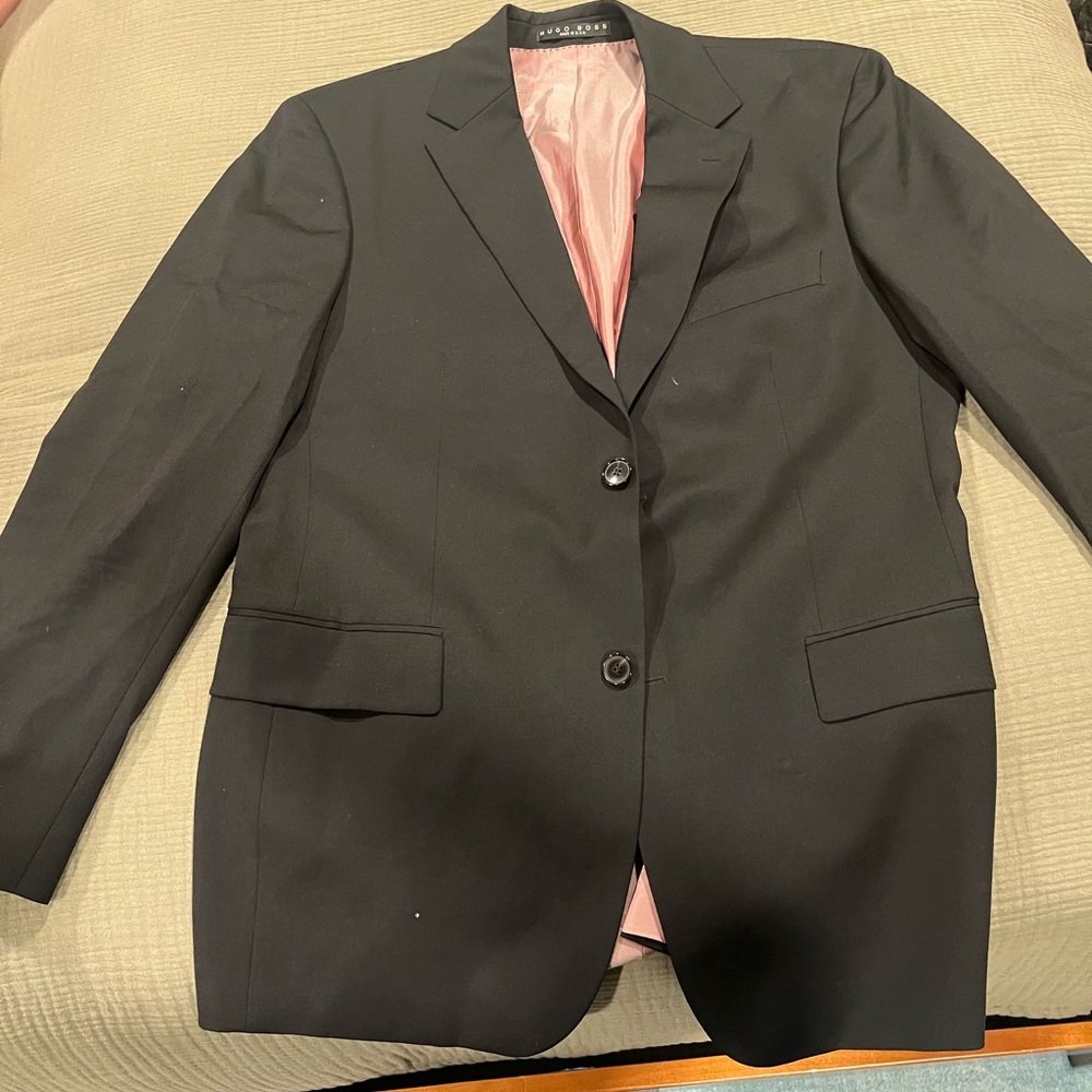Gorgeous Hugo Boss suit from the retail store. Jacket is size 40, pants are 34R